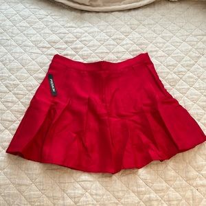 High-waisted red pleated shirt. Tags say XXL but is probably a L or even a M